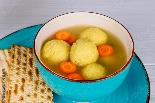 Matzah balls in a pot of soup during the Jewish holiday of Passover - Pesach.