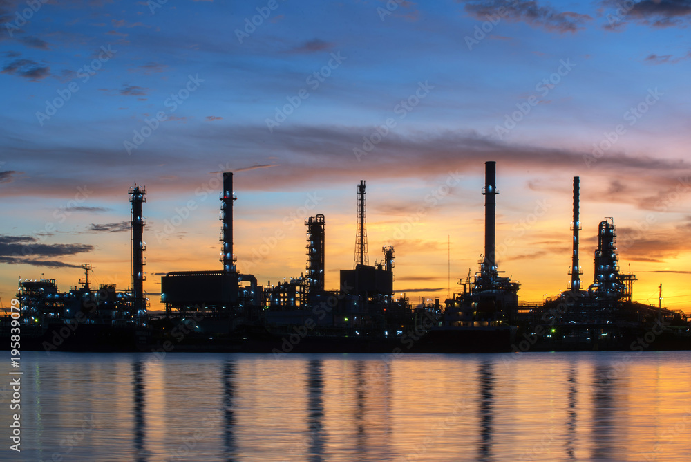 Oil and gas refinery at twilight - Petrochemical factory Oil and gas refinery at twilight - Petrochemical factory