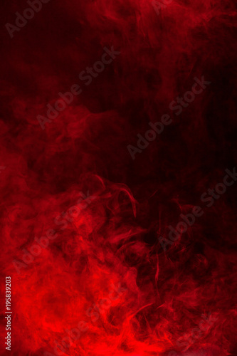 Red smoke or flame texture on a black background. Texture and abstract art