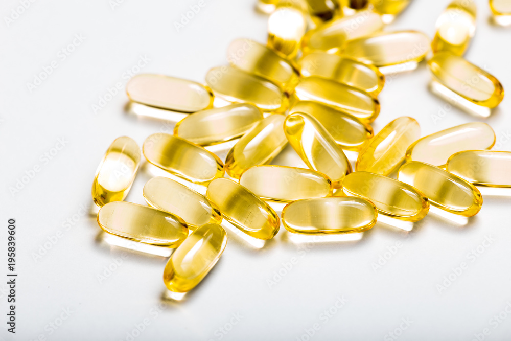 Fish oil capsules with omega 3 and vitamin D. healthy diet concept. Fish oil capsules with omega 3 and vitamin D. healthy diet concept.