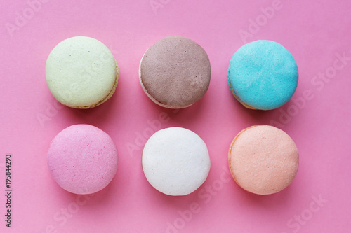six macarons cakes on pink background