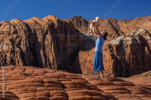 Mother and son on a trail in volcanic Snow canyon State Park in Utah, USA photo