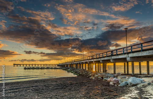 Colorful seascape with marine pier  Baltic Sea  Europe. The photo was taken at a famous Baltic resort city of Palanga  Lithuania