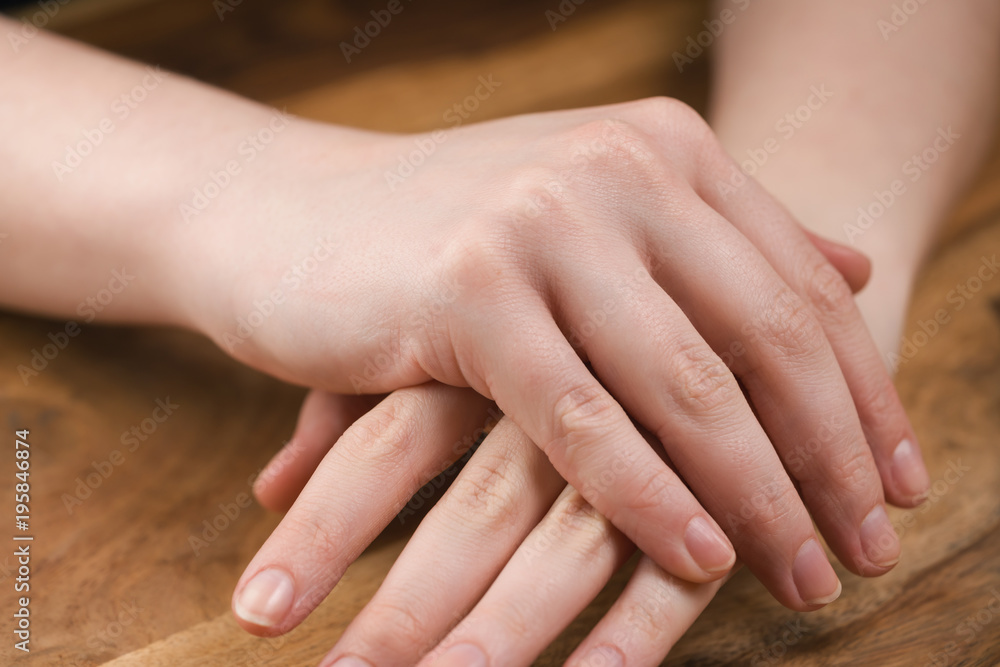 teen girl applying hand cream teen girl applying hand cream