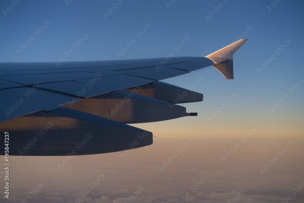 Fototapeta premium view of airplane wing during morning flight
