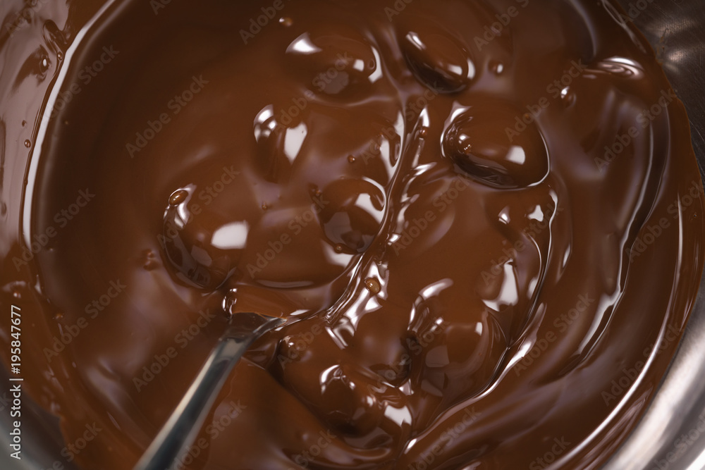 melting dark chocolate in steel bowl melting dark chocolate in steel bowl