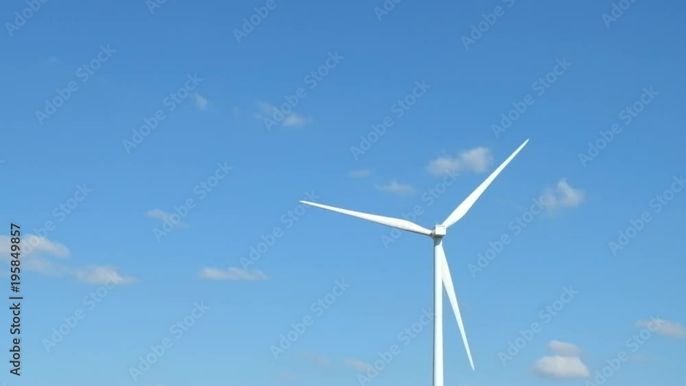 Wind turbine farm in the field - a renewable energy source Wind turbine farm in the field - a renewable energy source