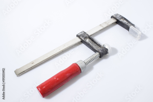 Clamp for wood in a white background composition