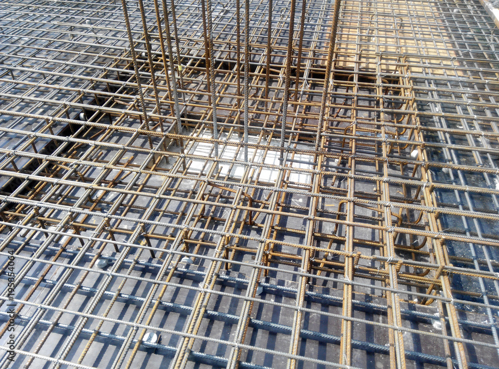 Steel reinforcement bar at the construction site. It uses to strengthen concrete. It is shaped follow the engineering design and tied together using tiny wire. 