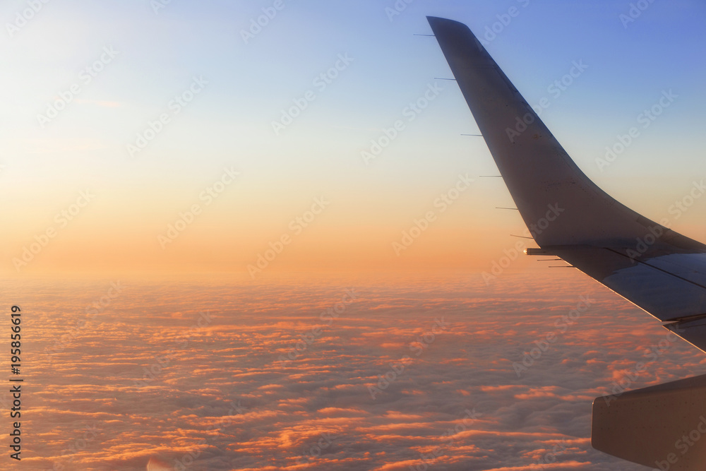 Obraz premium view from the airplane window at dawn during the flight