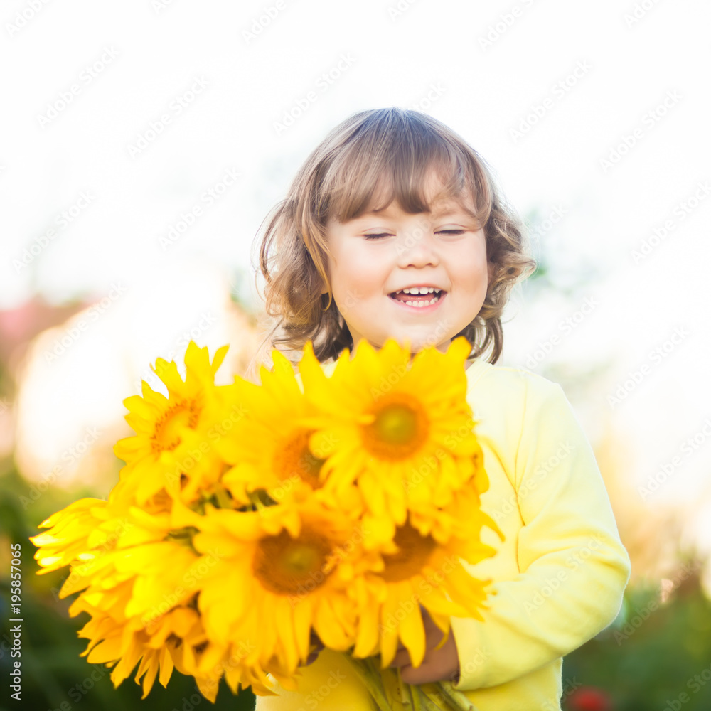 Happy child with bouquet of beautiful sunflowers. Happy child with bouquet of beautiful sunflowers.