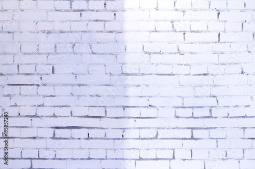 light and shadow on white brick wall background texture