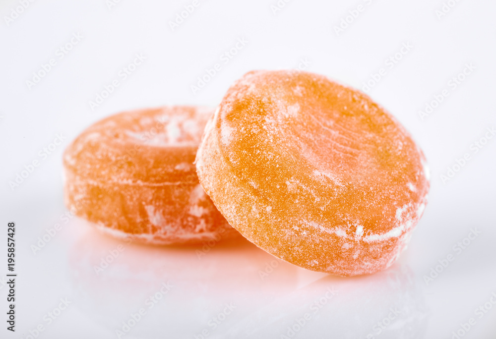 Colored round candy in powdered sugar. Bright candy. Colored round candy in powdered sugar. Bright candy.