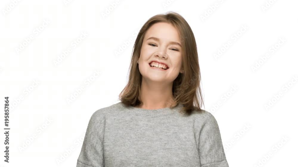 Portrait of positive woman 20s wearing basic clothing laughing or chuckling after amusing joke, isolated over white background in studio. Concept of emotions Portrait of positive woman 20s wearing basic clothing laughing or chuckling after amusing joke, isolated over white background in studio. Concept of emotions