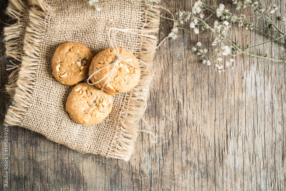 Top view and overhead shot of cookies on old wooden background,Homemade cookies on sackcloth Top view and overhead shot of cookies on old wooden background,Homemade cookies on sackcloth