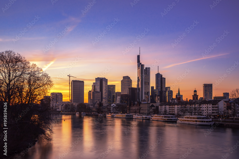 The skyline of the banking metropolis in Frankfurt am Main during a beautiful sunset. Frankfurt, Germany / 5 March 2018 The skyline of the banking metropolis in Frankfurt am Main during a beautiful sunset. Frankfurt, Germany / 5 March 2018