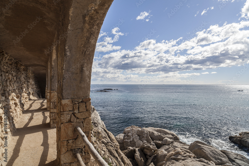 Parapet walk, cami de ronda, by the mediterranean sea in Costa Brava, Platja Aro, Catalonia, Spain.