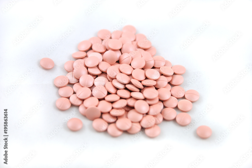 Rose round tablets close-up on white background Rose round tablets close-up on white background