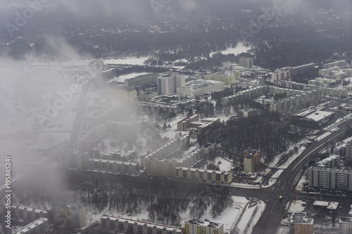 Aerial view of city with clouds, winter-time