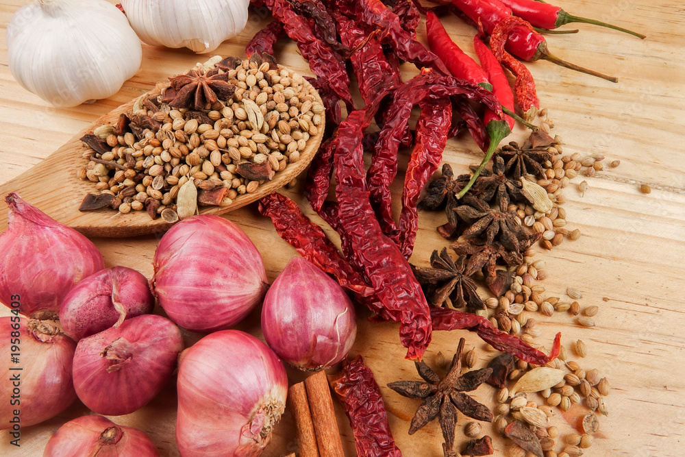 Mixture of beautiful spices and herbs on a wooden table Mixture of beautiful spices and herbs on a wooden table