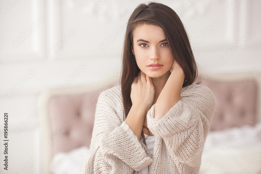 Obraz premium Portrait of beautiful young woman indoors. Pretty girl close up portrait