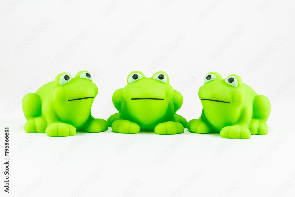 3 Green Rubber Toy Frogs Stock Photo