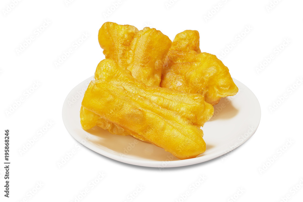 Deep-fried dough stick on white plate isolated white backgroun with clipping path. Deep-fried dough stick on white plate isolated white backgroun with clipping path.