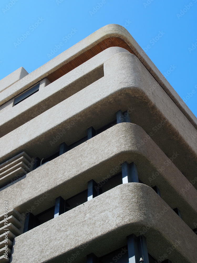 Concreat Rounded Corner corner of a brutalist concrete concrete tower block with textured ...