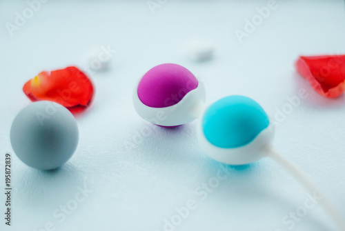 Color Kegel balls, Geisha balls in white background photo