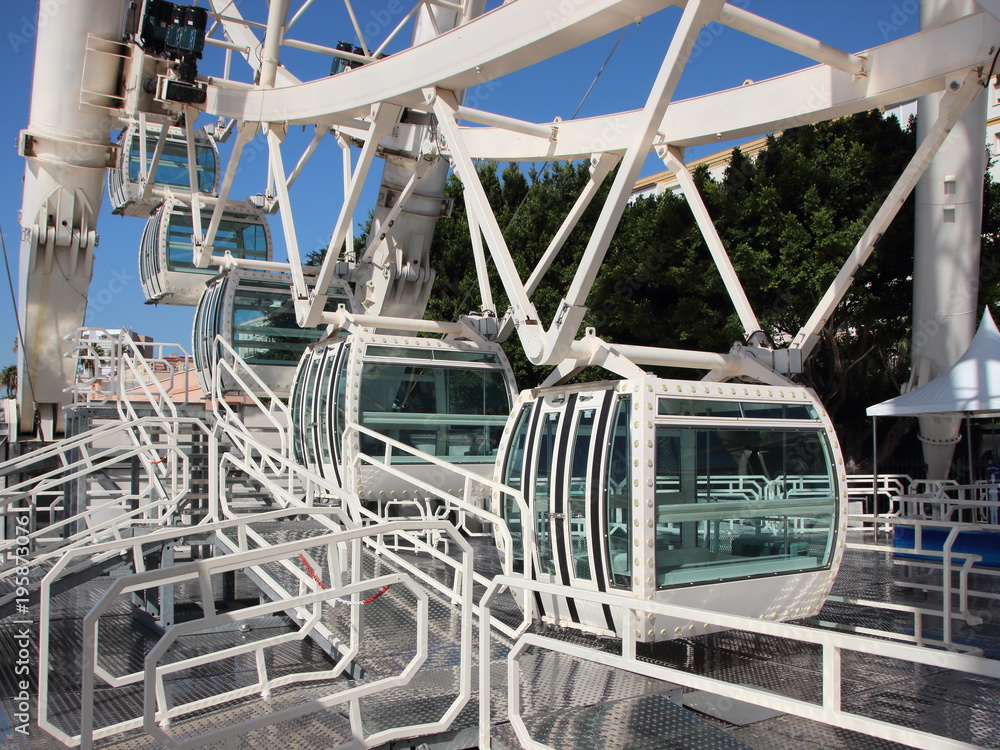 Fototapeta premium White Solid Ferris Wheel Cabins Closeup Perspective