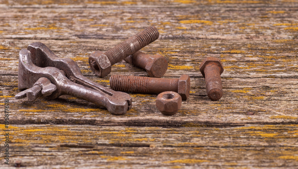 Old rusty nuts, bolts. Ancient tools. A dream of old molded boards Old rusty nuts, bolts. Ancient tools. A dream of old molded boards
