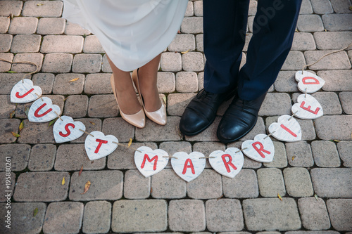 Beautiful wedding inscription just married. Close-up beauty placard. Bridal and groom accessories. Details for marriage, decoration for couple