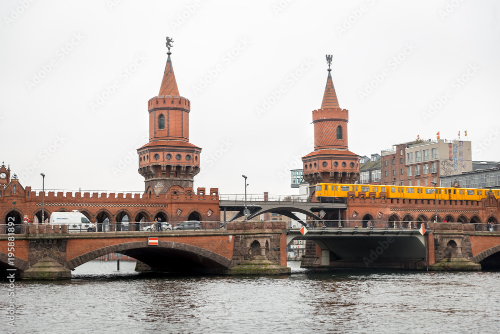 U-Bahn train passing over Oberbaum Bridge in Berlin, Germany