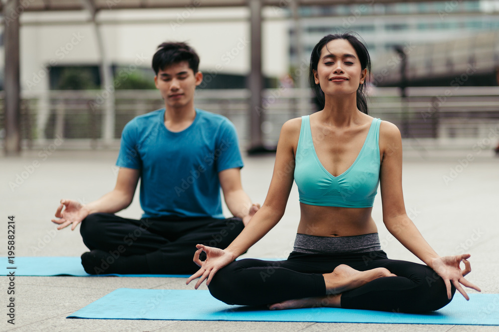 peoples do yoga and relaxation in city. Vital and meditation for fitness lifestyle outdoor. Concept Yoga peoples do yoga and relaxation in city. Vital and meditation for fitness lifestyle outdoor. Concept Yoga