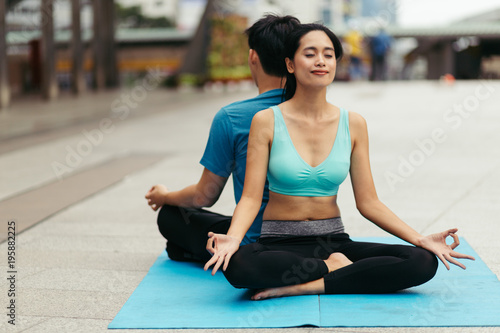 peoples do yoga and relaxation in city. Vital and meditation for fitness lifestyle outdoor. Concept Yoga