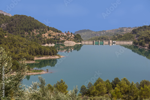 Panorama of the reservoir and dam near Guadalest. Alicante. Spain. Summer afternoon.