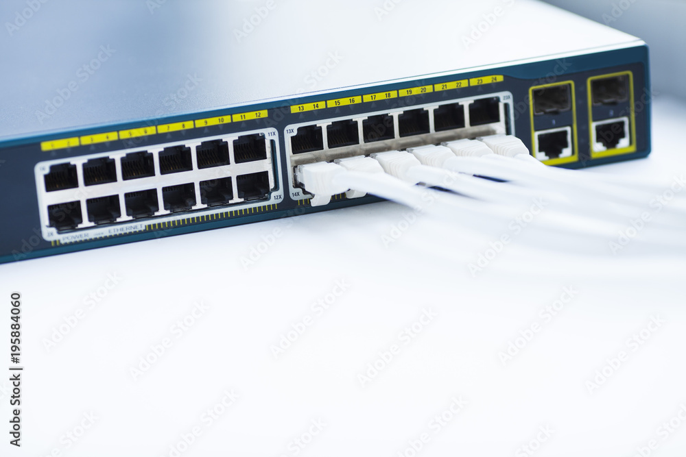 Corporate network concept. Set of ethernet switches, access points, cables, connectors, laptops on the white background. Top view. Space for a text. Close up. Corporate network concept. Set of ethernet switches, access points, cables, connectors, laptops on the white background. Top view. Space for a text. Close up.