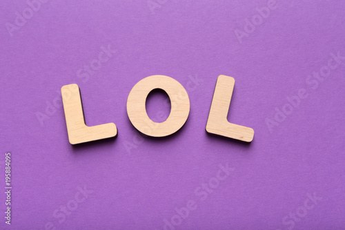 LOL abbreviation spelled with wooden letters