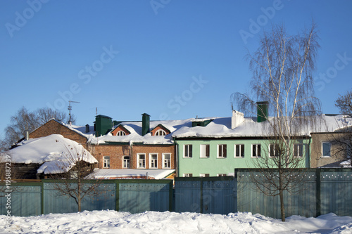 Old houses in ancient Russian city of Kolomna, Moscow region, Russia, after snowfall. Winter overcast day.