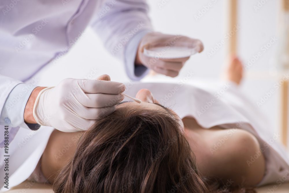 Fototapeta premium Police coroner examining dead body corpse in morgue