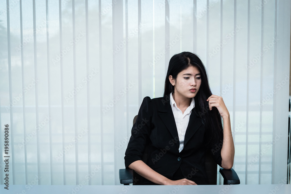 Close up sad woman in the office,stress girl from hard work,Heartbreak from boyfriend,Thailand people Close up sad woman in the office,stress girl from hard work,Heartbreak from boyfriend,Thailand people
