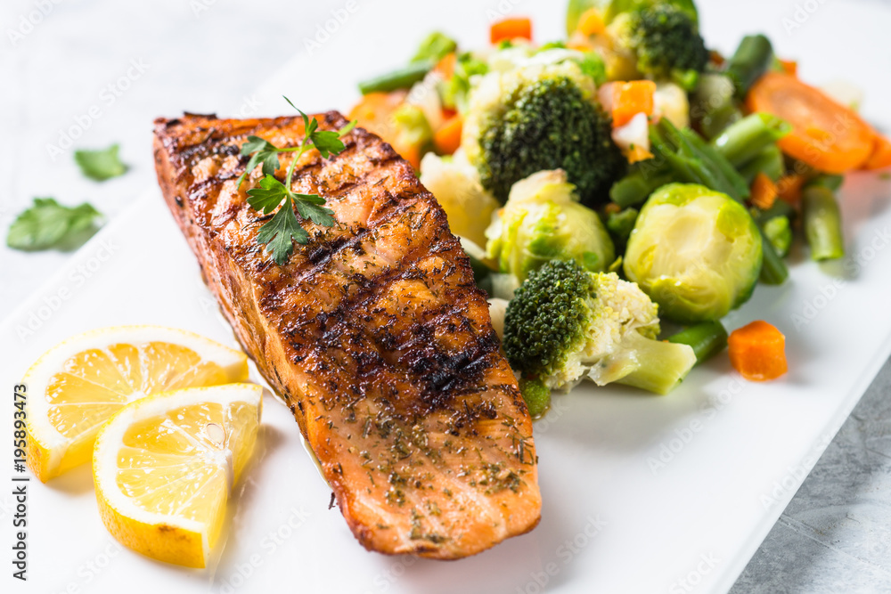 Grilled salmon fillet with vegetables mix. Grilled salmon fillet with vegetables mix.