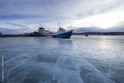 old ship locked in ice in lake Khovsgol in Northern Mongolia photo