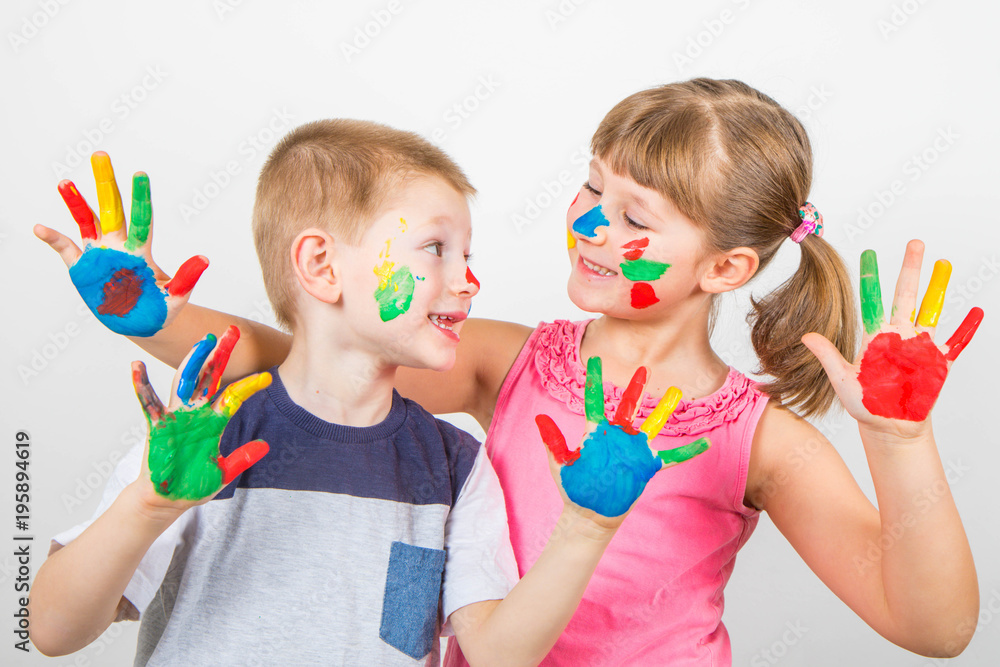 little smiling children with hand painted in colorful paints little smiling children with hand painted in colorful paints