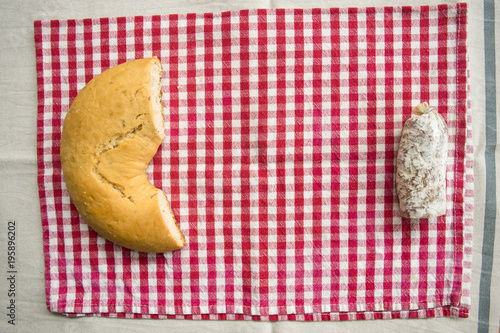 piece of salami near a savoury doughnut