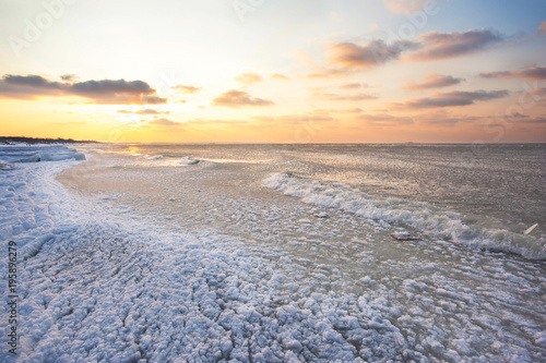 cold ice-covered sea during sunset