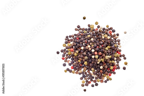 Top view on black, red and white peppercorns isolated on white background, shallow depth of field. photo