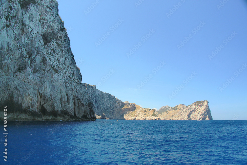 Amazing stone landscape and blue water of mediterranean sea. Beautiful background. Spain. Palma de Majorca.