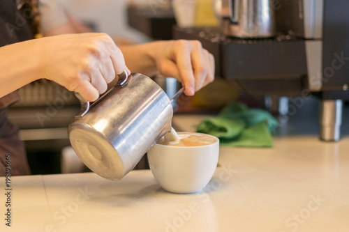 Barista prepares cappuccino. Sunny morning. Coffee machine in cafe