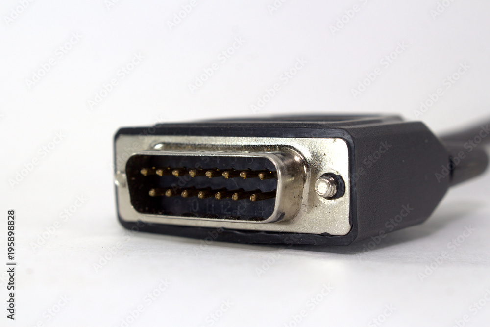 Computer connector of a scanner for car diagnostics on a white background close-up Computer connector of a scanner for car diagnostics on a white background close-up